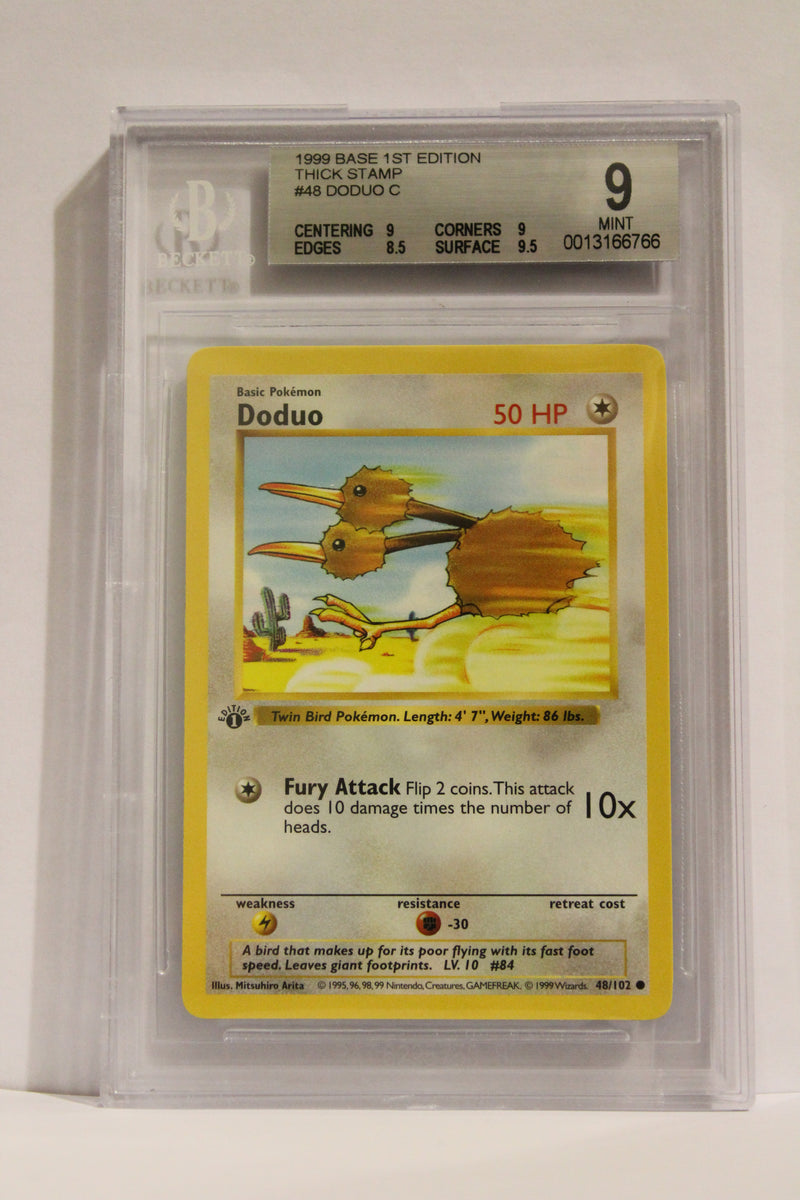 Doduo (48/102) 1st Edition/Thick Stamp Common [Base Set (Shadowless)] Beckett 9