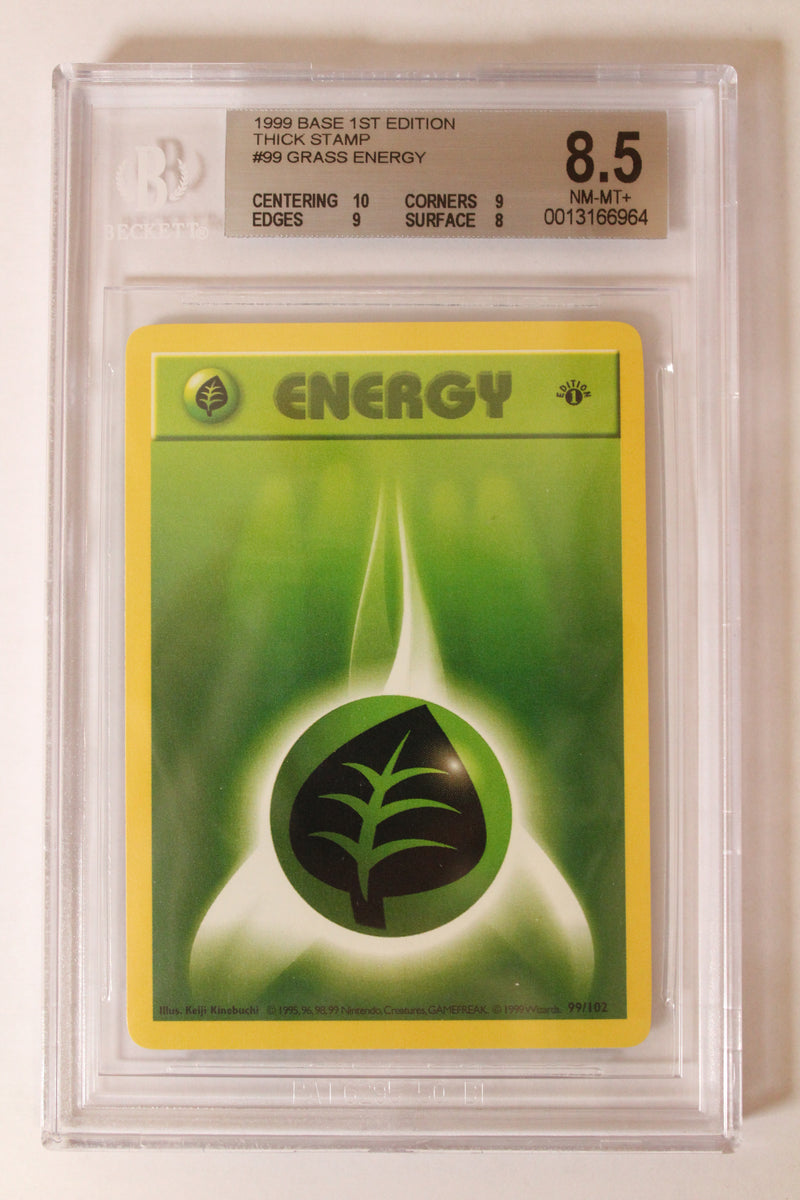 Grass Energy (99/102) 1st Edition/Thick Stamp [Base Set (Shadowless)] Beckett 8.5